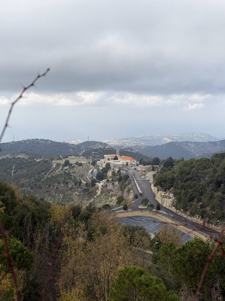 The monastery of Saint Charbel at Annaya, with the mountains of Lebanon behind