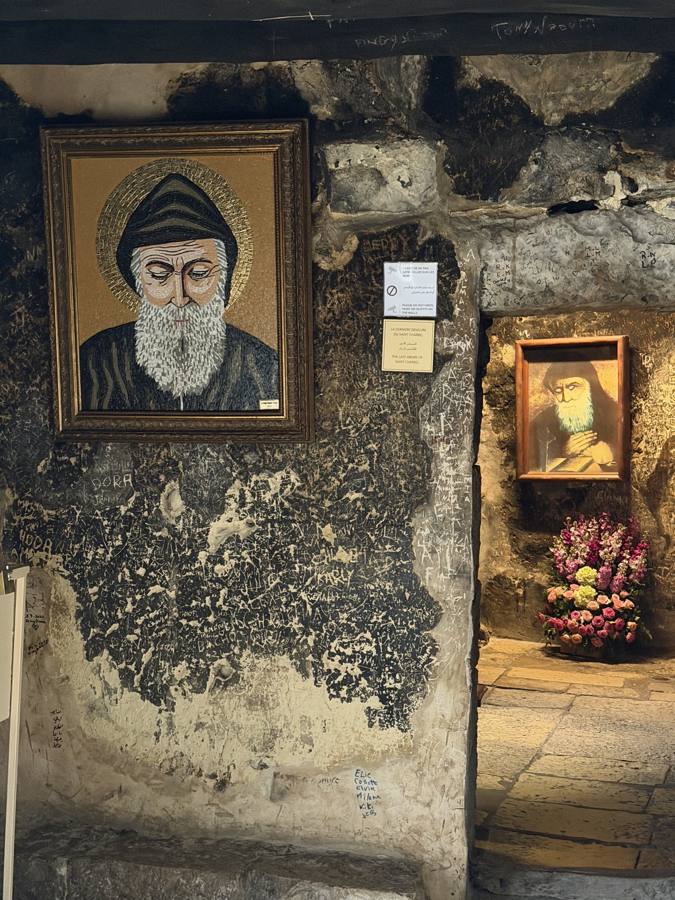 An icon of Saint Charbel on the stone wall of the hermitage